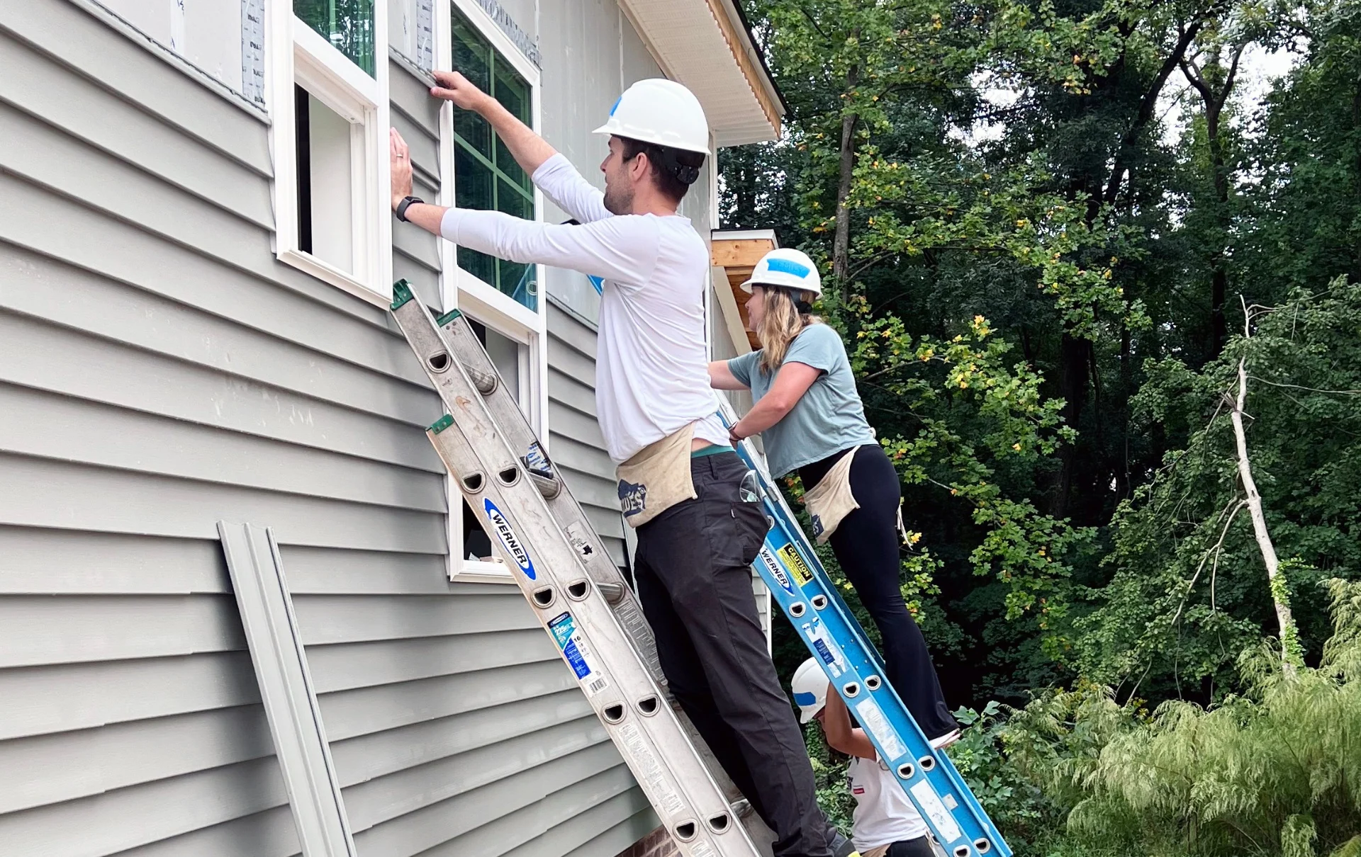 Volunteers building homes